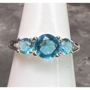 Ring Bomb Party Ring, NWOT, Size 6 Aqua blue stones silver color band